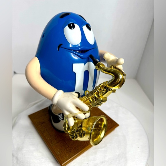 Vintage Blue M&M Candy Dispenser with a Saxophone. (C) - Picture 1 of 5